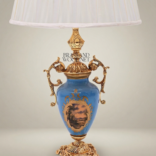 Classical Blue Porcelain Urn Table Lamp with Ornate Brass Scrollwork Handles and Hand-Painted Landscape Medallion White Pleated Shade Brass and Wood Gold Front | Brass & Wood