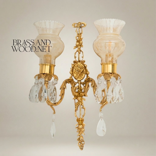 Louis XVI Twin Arm Brass Wall Sconce with Crystal Pendants Fluted Glass Shades Ornate Cartouche Gold Front | Brass & Wood
