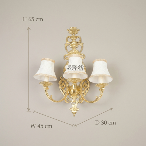 Rococo Three-Arm Brass Wall Sconce Acanthus Scrollwork Ivory Fabric Shades Brass and Wood Antique gold Front | Brass & Wood